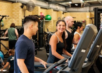 People using the gym equipment